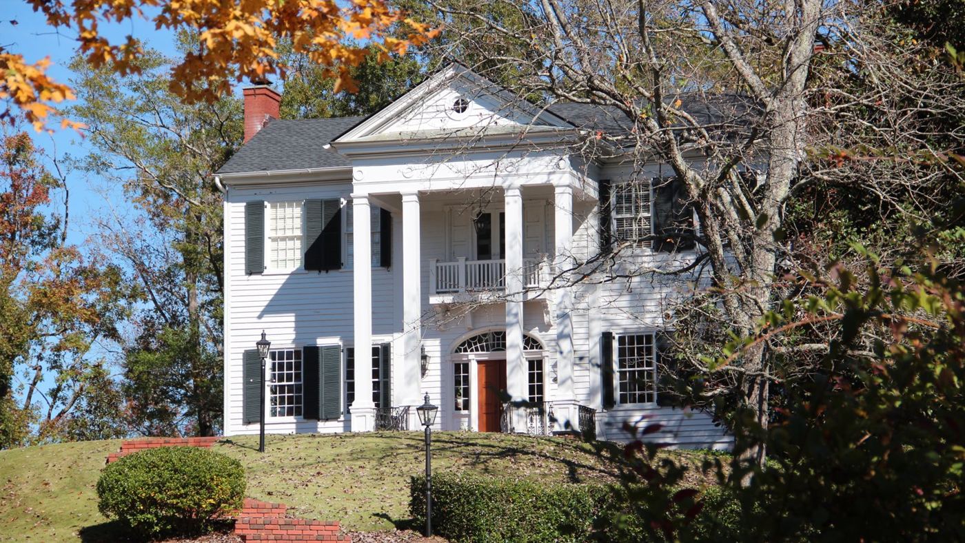 Historic home on a hill in Rome, GA in the fall